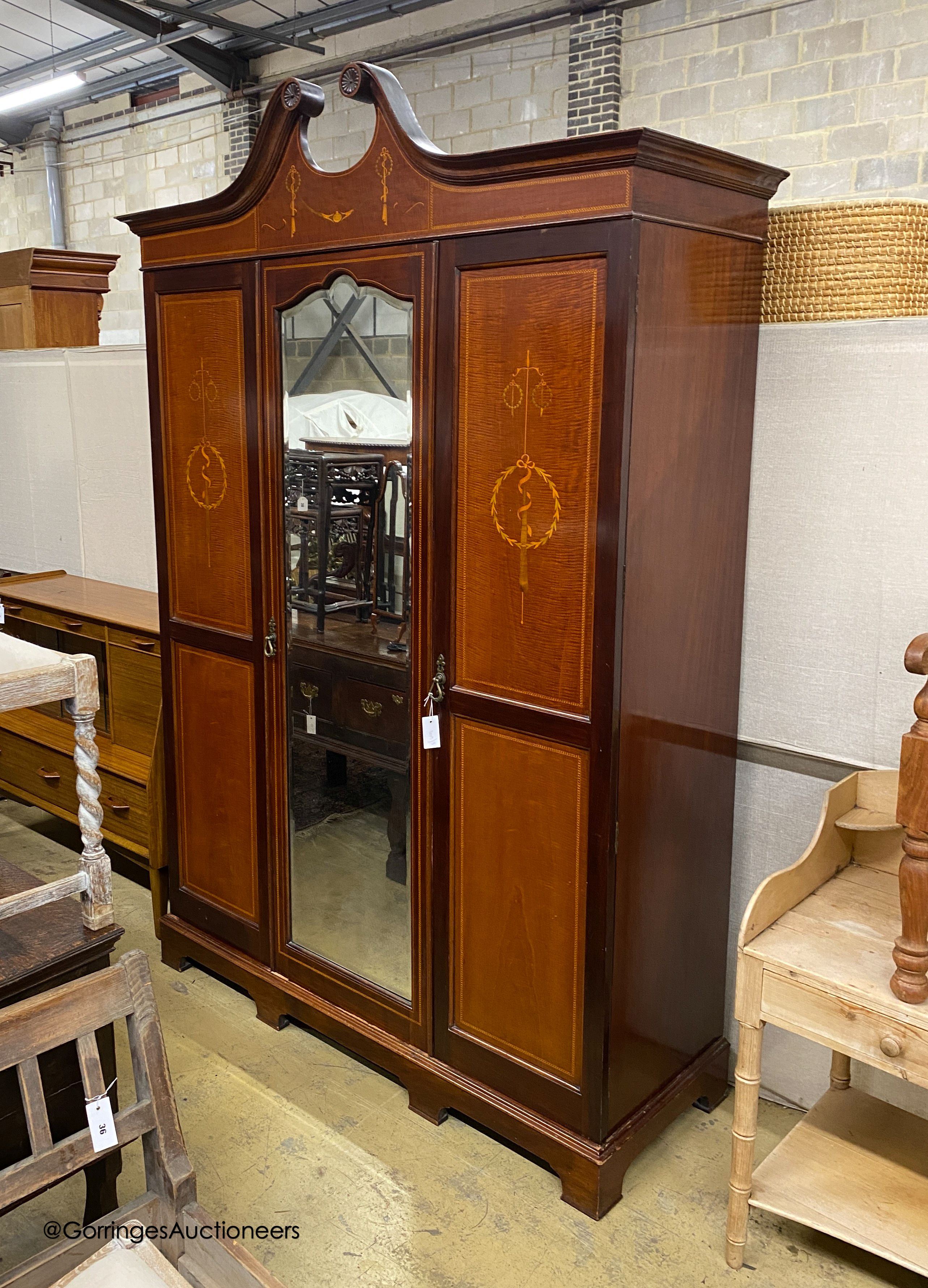 An Edwardian marquetry inlaid mahogany wardrobe, length 154cm, depth 58cm, height 230cm